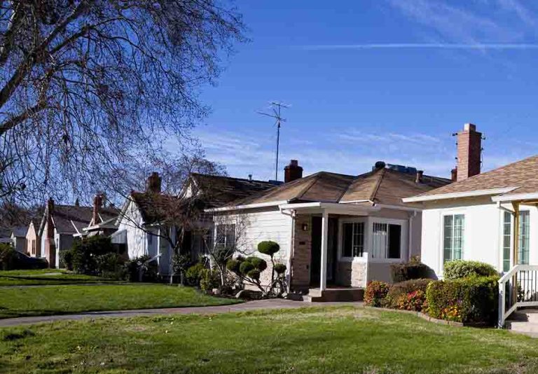 Several houses with front yards