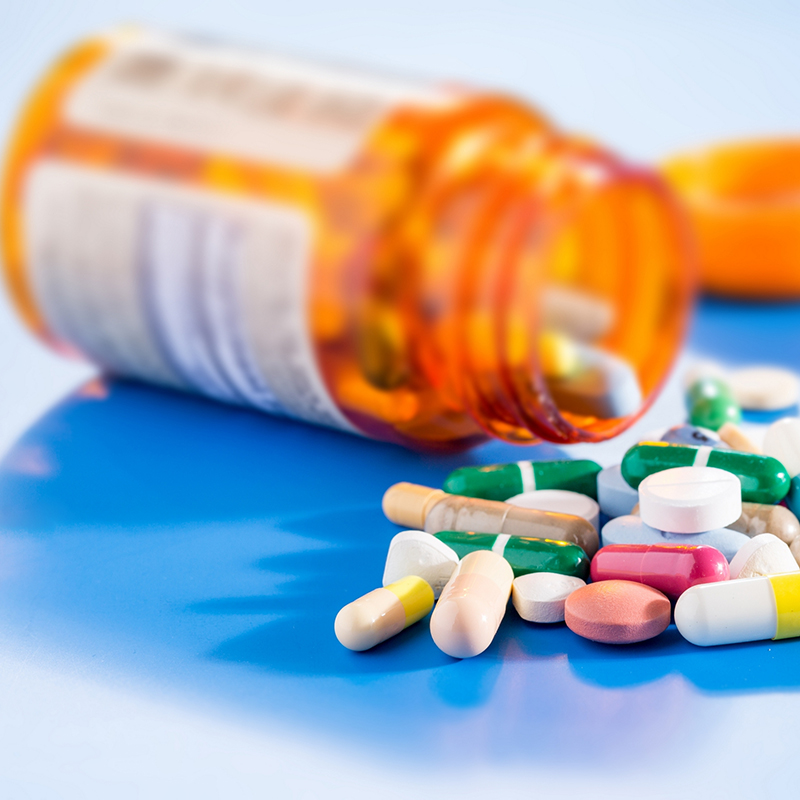 Pills and capsules in medical vial